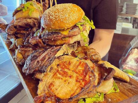 A platter piled high with meat and hamburgers from Bufalero Restaurant in Rome.