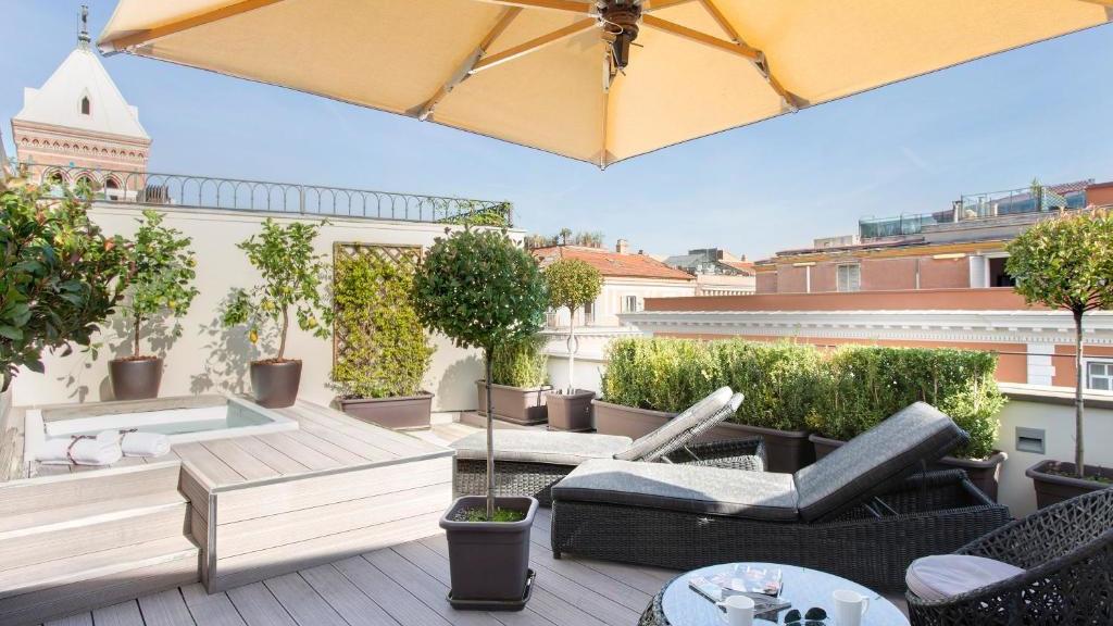 The rooftop Jacuzzi at Hotel Artemide in Rome, overlooking the city on a lovely sunny day.
