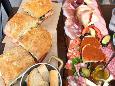 Plates piled high with delicious sandwiches and meat from Pane e Salame restaurant in Rome.