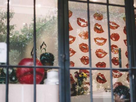 Looking in the window of a funky shop with lips artwork everywhere in the Maboneng Precinct in Johannesburg.