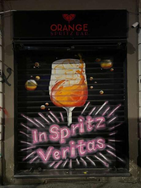 The iconic graffiti outside the Orange Spritz gay bar in Milan.