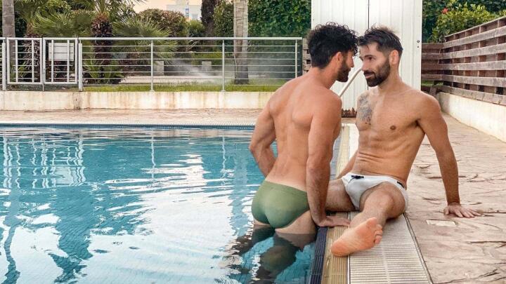 Stef and Seb in Teamm8 Speedos by their pool.