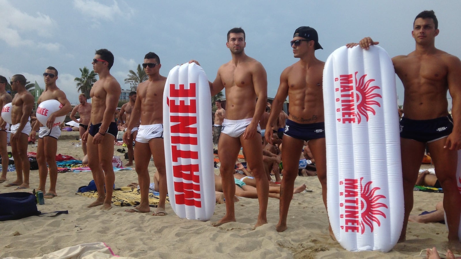 Boys in ES Speedos on Marbella gay beach in Barcelona.