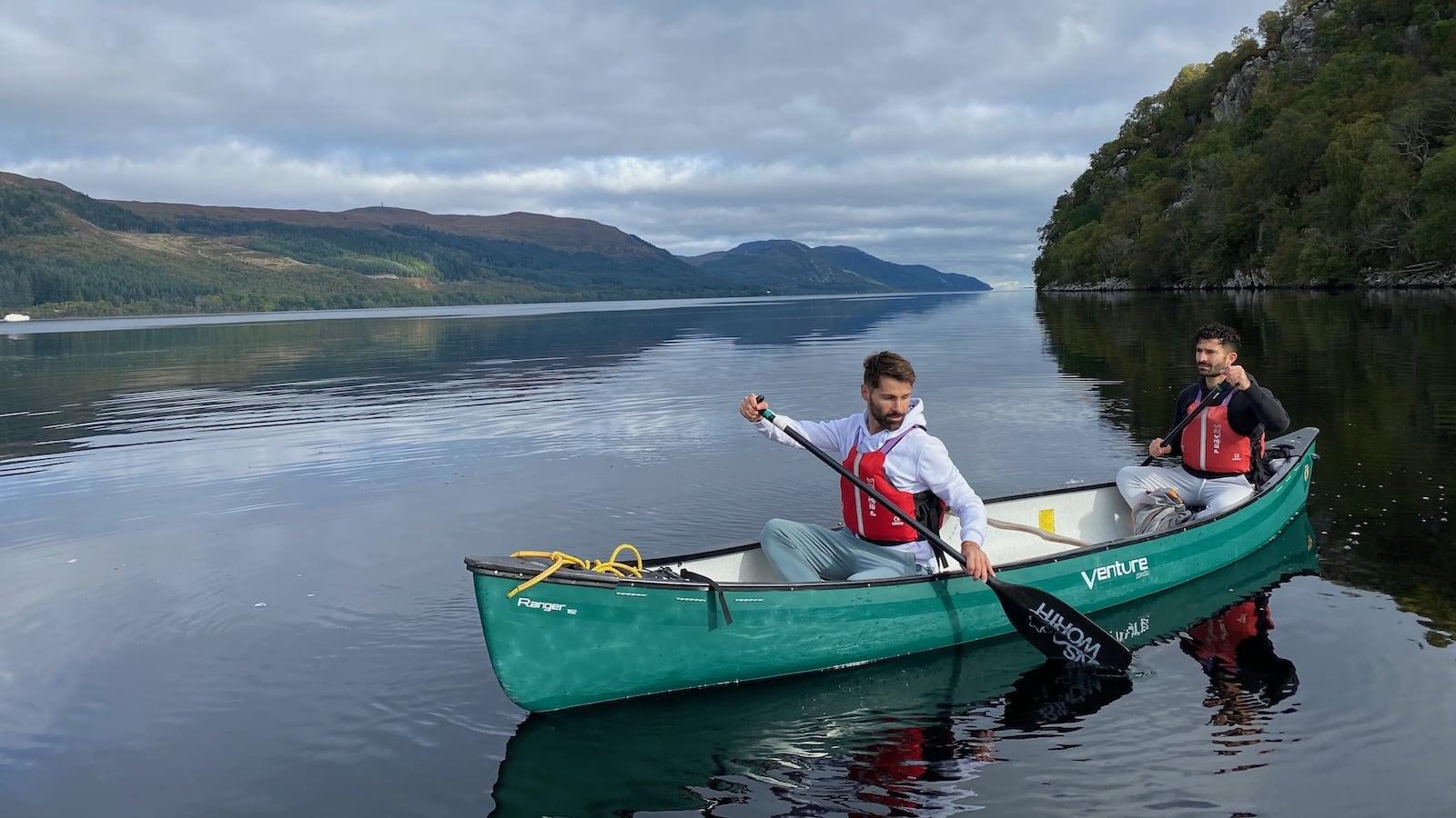 Gay couple on the Loch Ness river in the Highlands of Scotland.