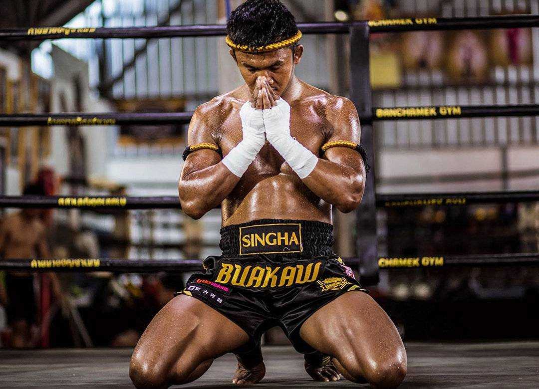 A traditional Muay Thai fighter bowing before a bout.