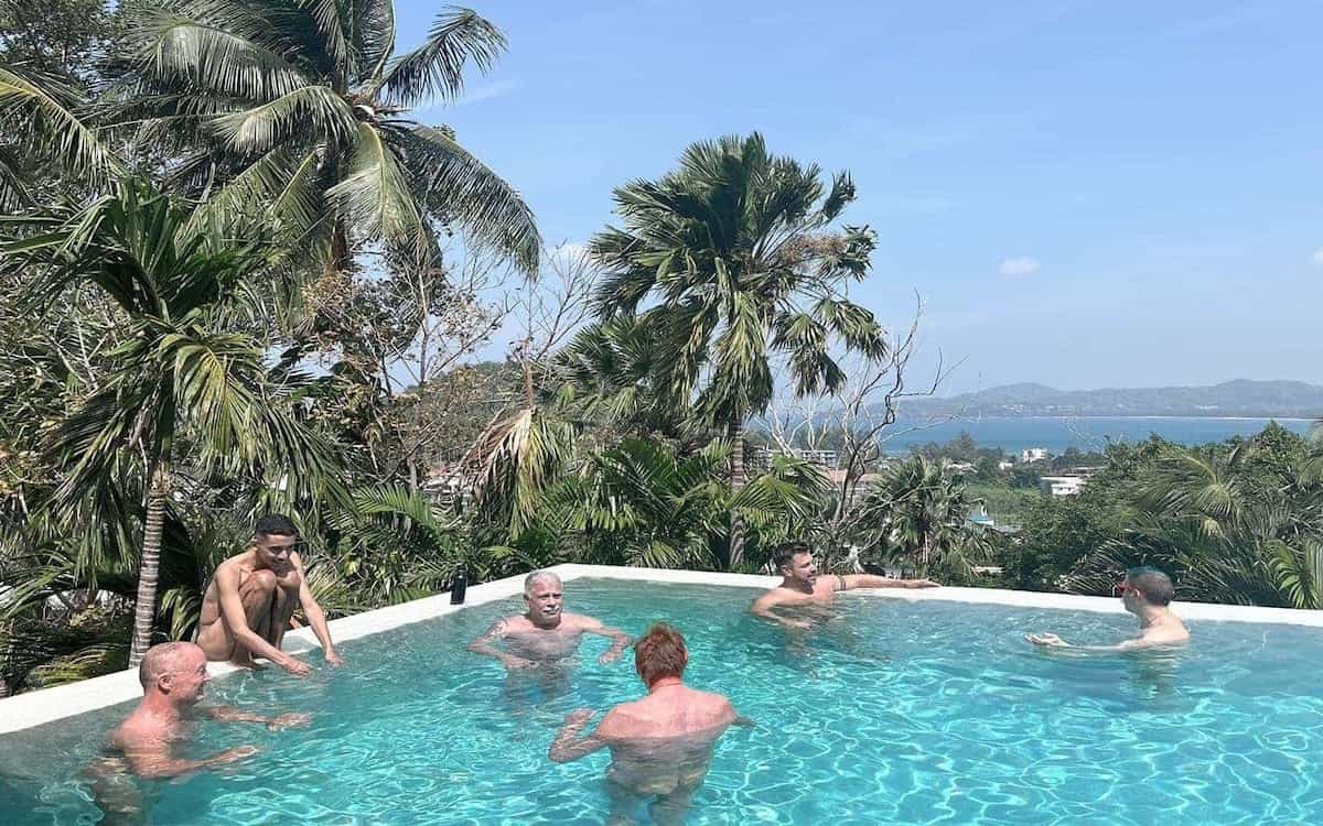 Everything To Sea Thailand villa group of men in pool.