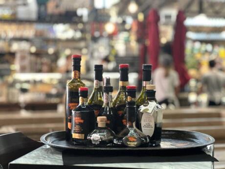 A tray of bottles of Balsamic vinegar for tasting in a shop in Modena, Italy.