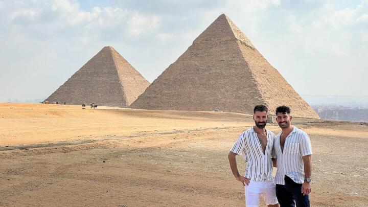 Gay couple at Egypt pyramids in Giza.