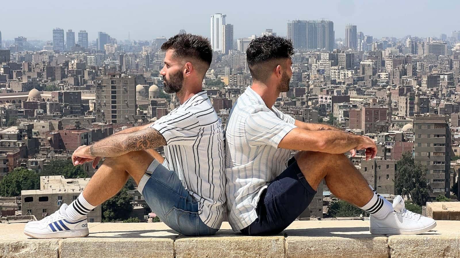 Gay couple in Cairo back to back.