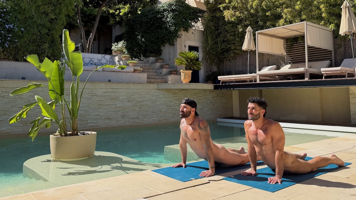 Gay couple doing naked yoga at The Naked French Experience Villa.
