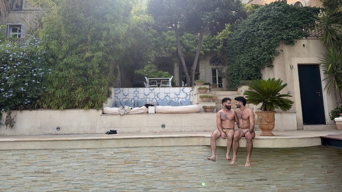 Stef and Seby gay couple sitting by the pool in French villa.