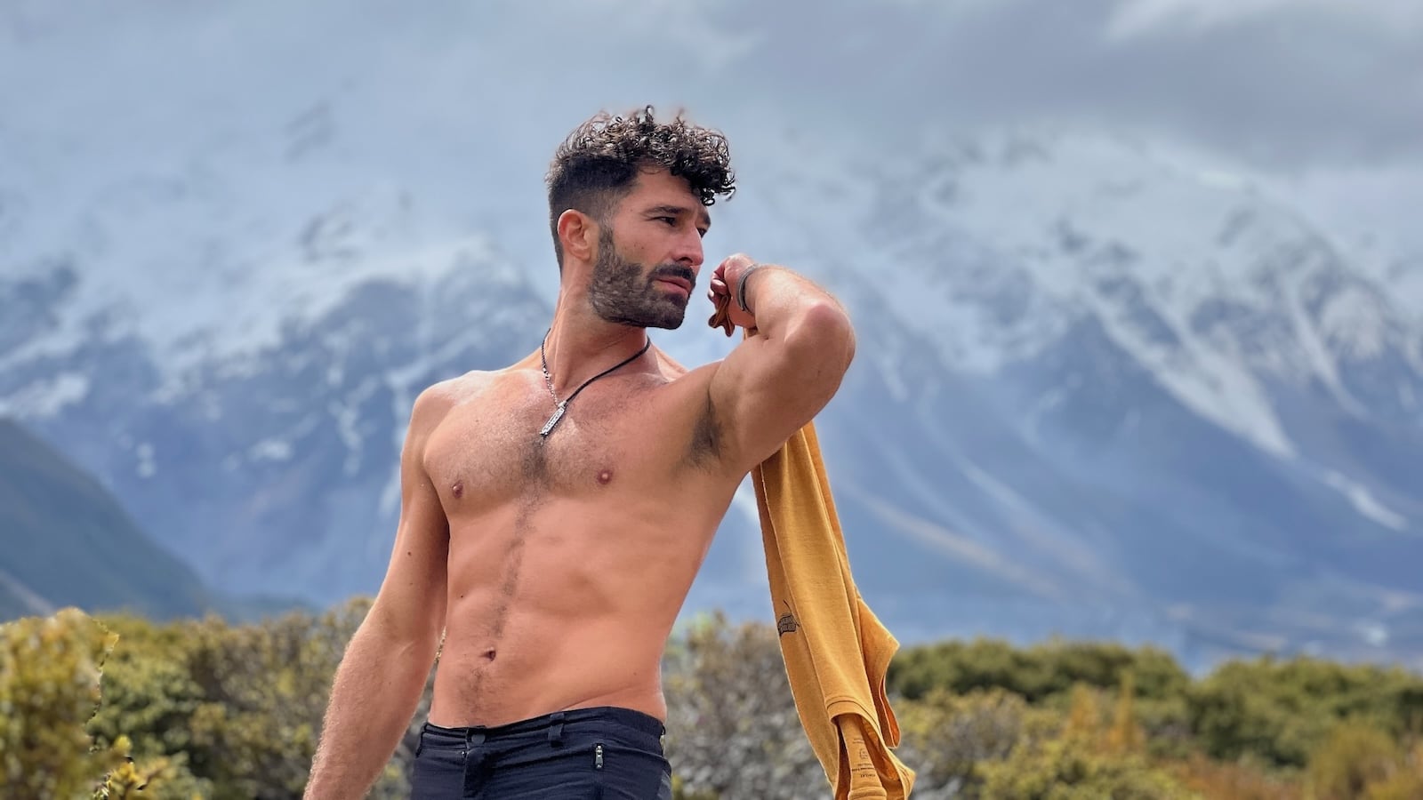 Stefan shirtless in Mount Cook celebrating gay Pride in New Zealand.