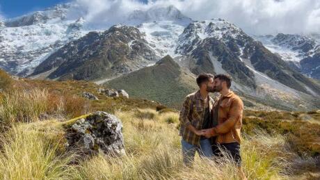 Gay couple kissing at Mount Cook on the Hooker Valley Track.