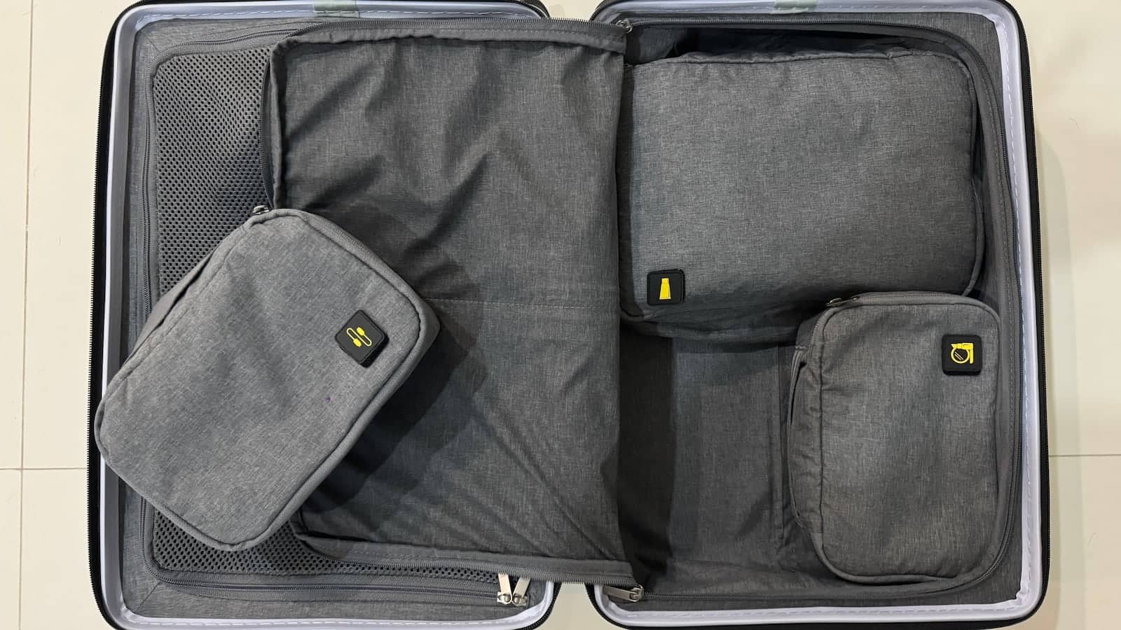 Packing cubes organised inside suitcase.