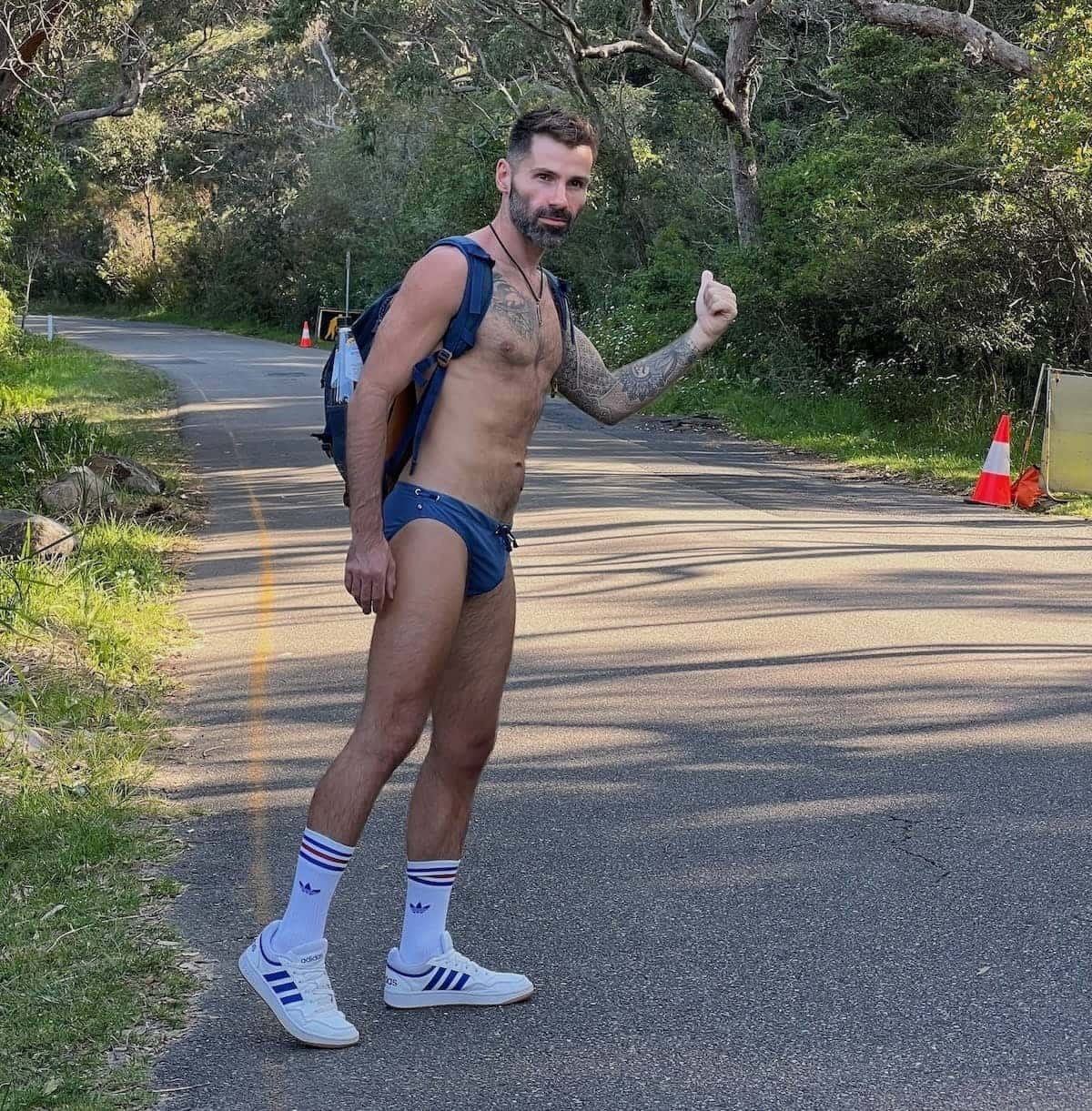Seby hitch hiking at Sydney gay Obelisk beach wearing Teamm8 gay underwear.