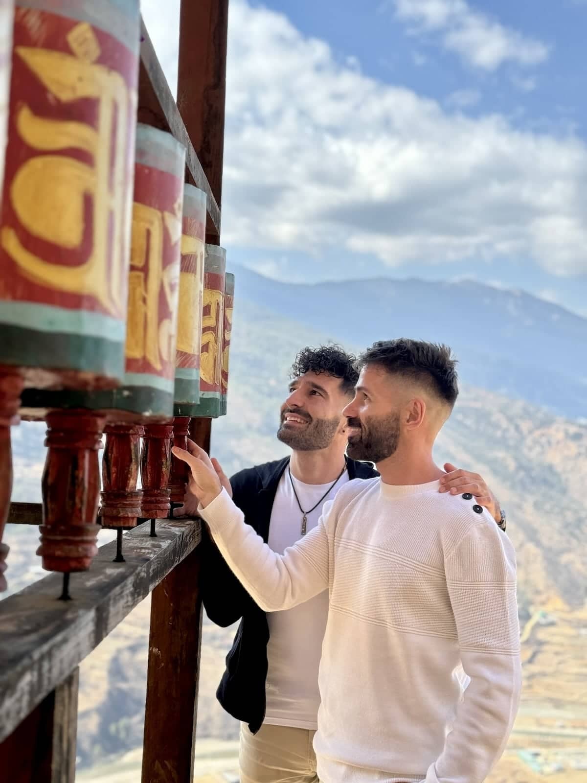 Gay couple at the prayer wheels of the Drak Karpo Monastery in Paro.