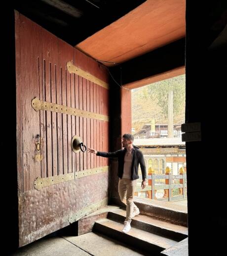 Stefan with giant door at the Paro Dzong in Bhutan.