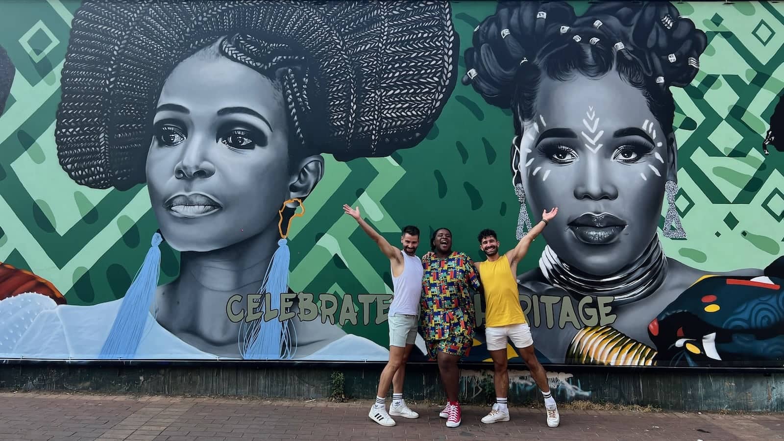 Nomadic Boys with Sebo of Caraci Clothing in the Maboneng district of Johannesburg with beautiful street art background.