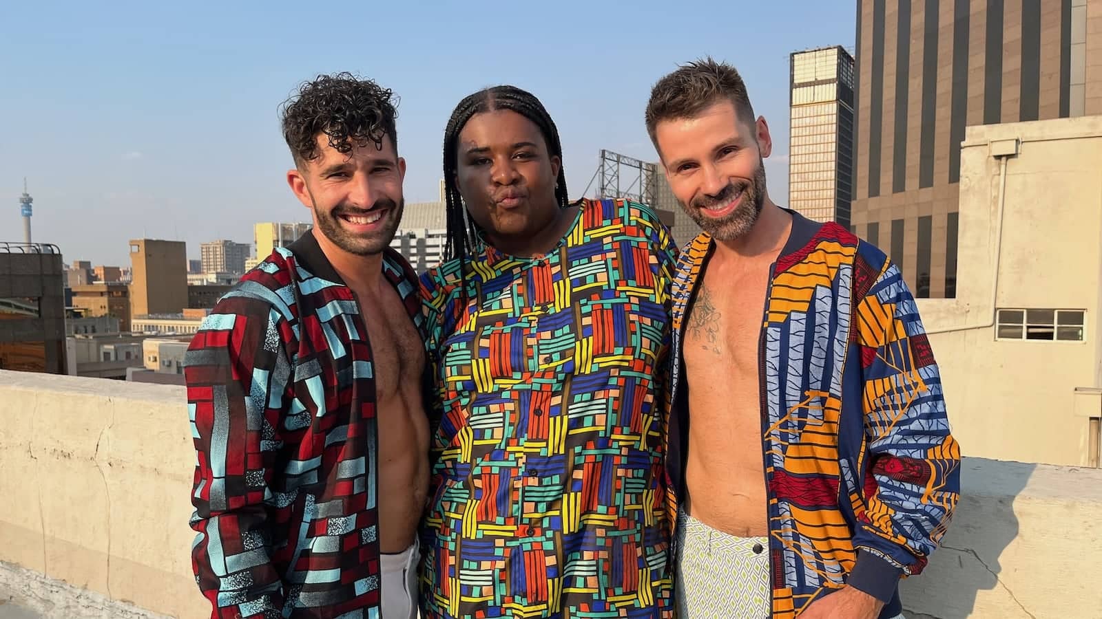 Sebo posing with gay couple Stefan and Seby of Nomadic Boys in Downtown Johannesburg.