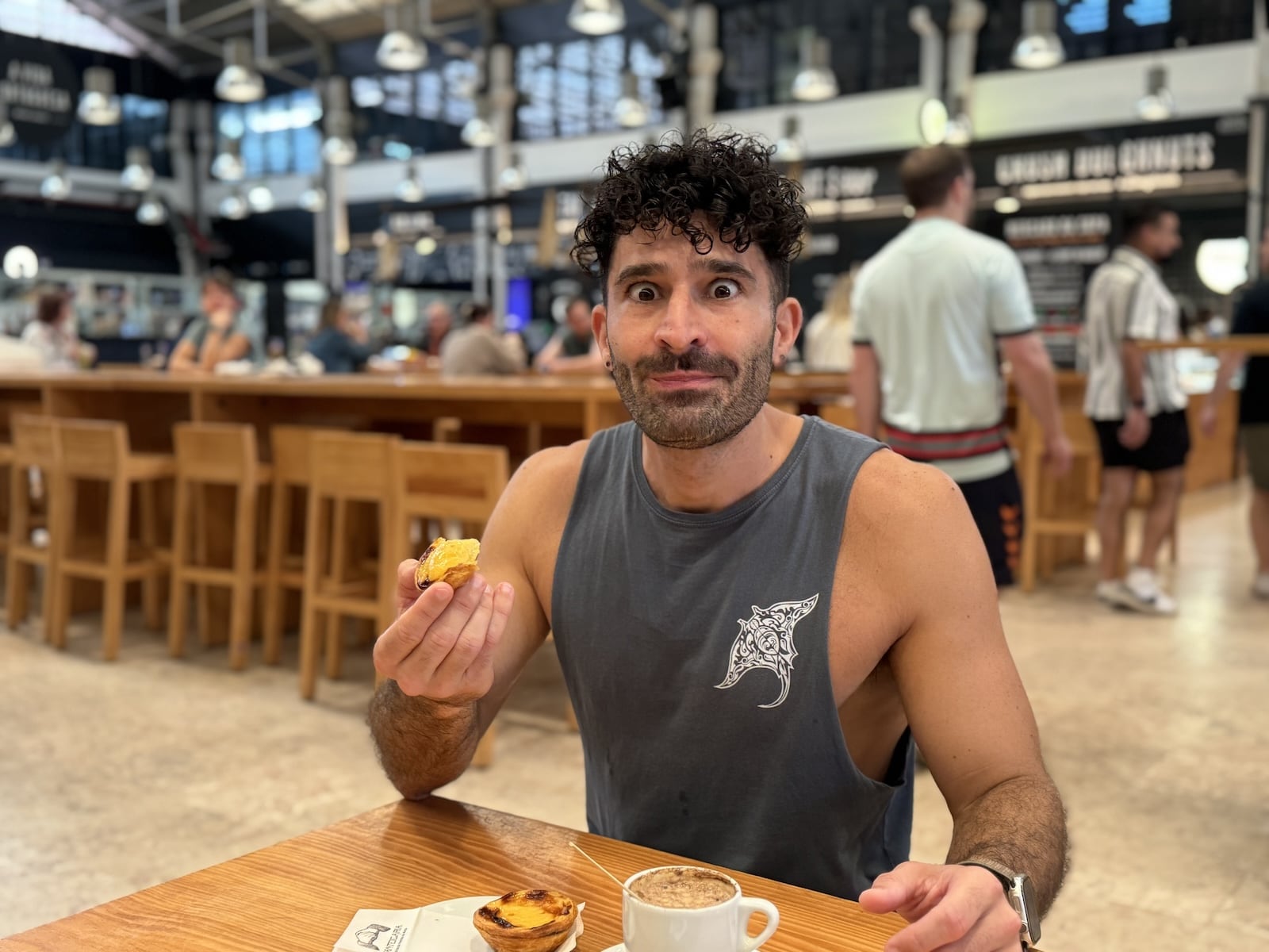 Stefan trying Pasteis de Nata at the Time Out Market in Lisbon.