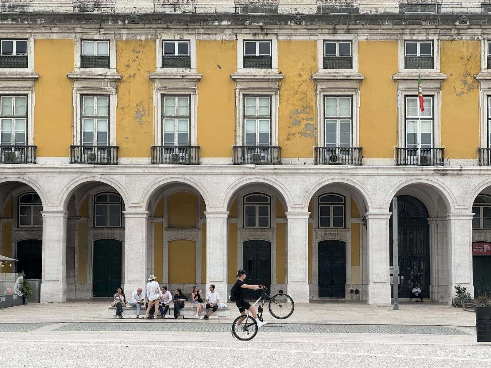 Cyclist showing off in the main square of Lisbon.