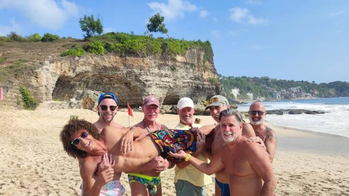 Gay group on the beach for Everything To Sea's Naked Paradise Villa experience in Bali.