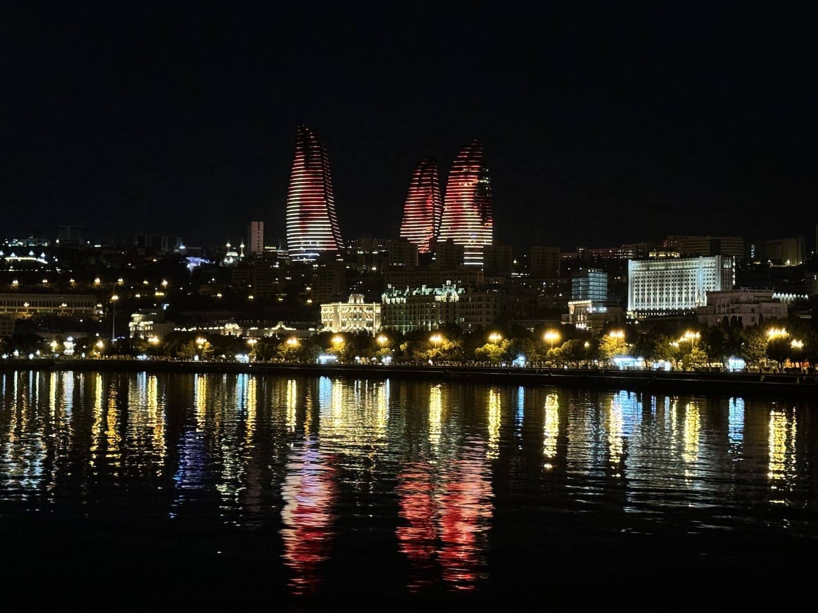 The iconic Flame Towers of Baku lit up at night.