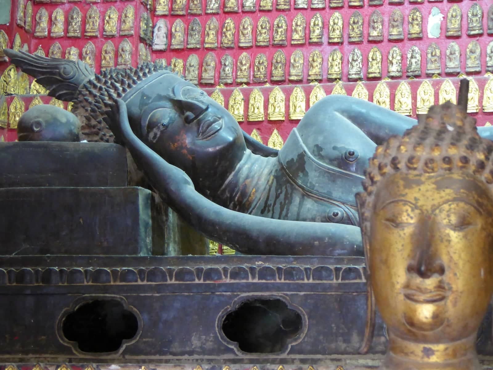 Luang Prabang Old Town Wat Xieng Thong Golden Temple reclining buddha in Laos.