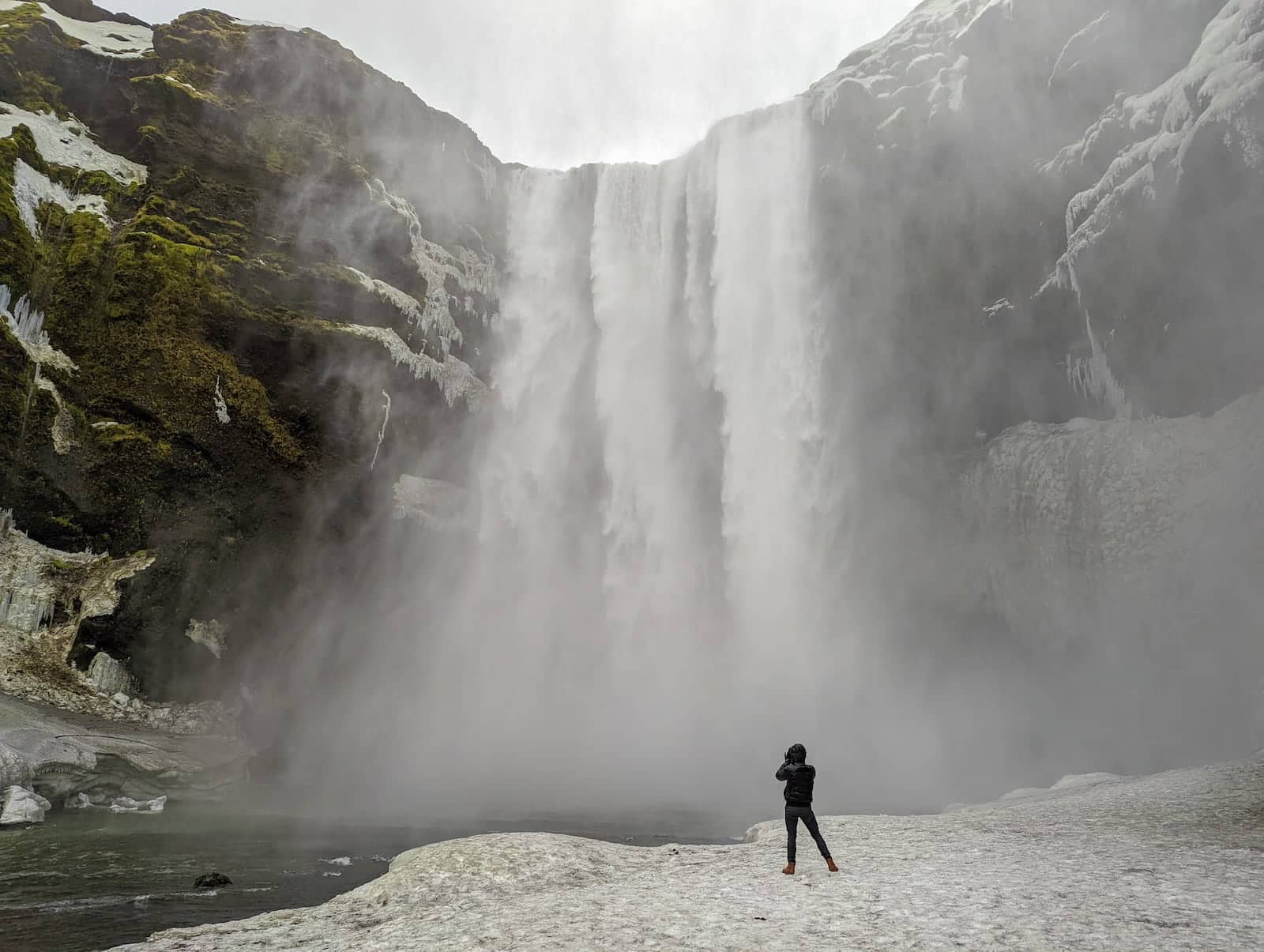 Stefan watching Skogafoss waterfall up close in Iceland.