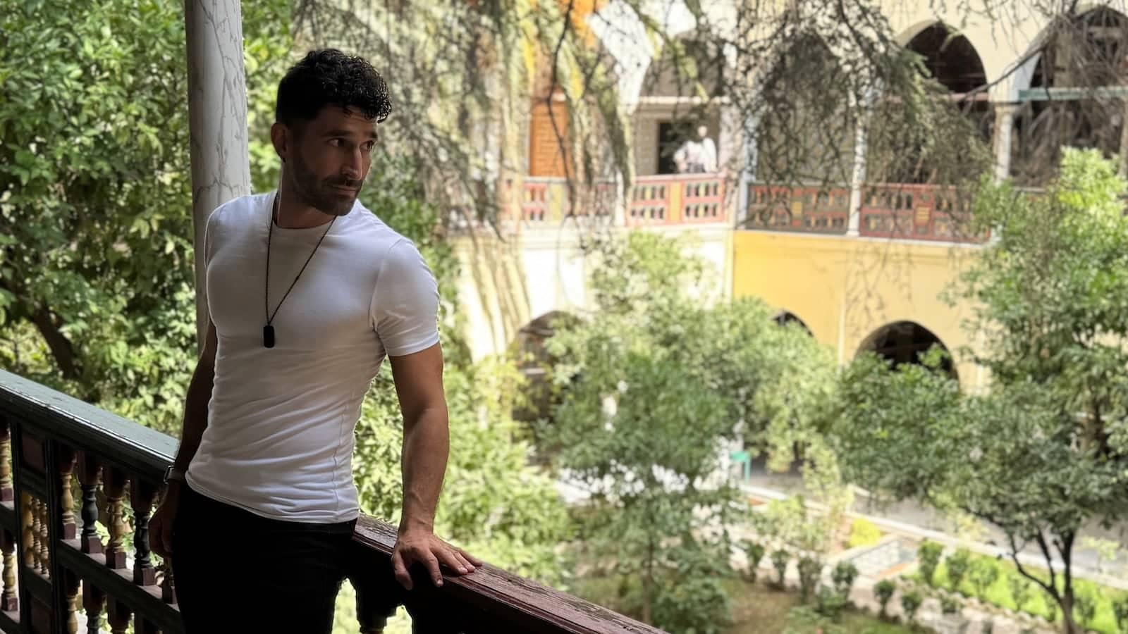 Stefan leaning on a balcony at the Ahmed Bey Palace in Constantine in Algeria.