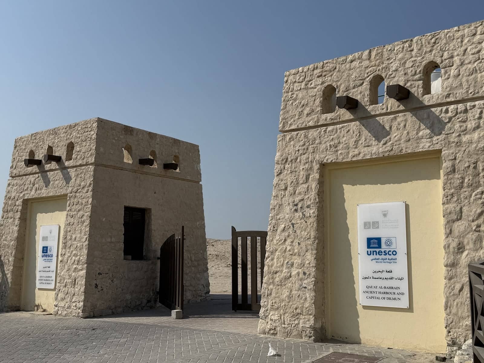 Two stone structures with a UNESCO World Heritage Sign on the front of them.