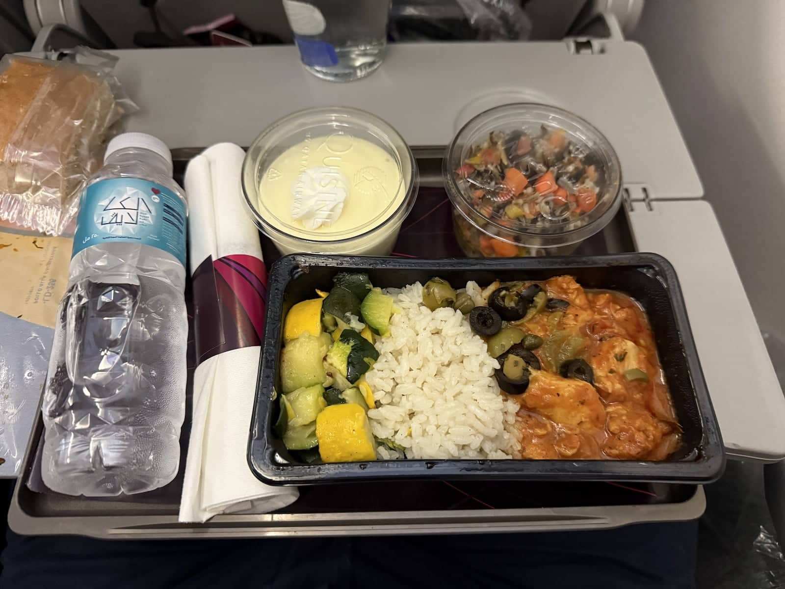 A tray of food on a Qatar Airways flight.