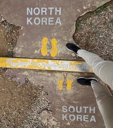 A line on the ground showing the border between North Korea and South Korea.