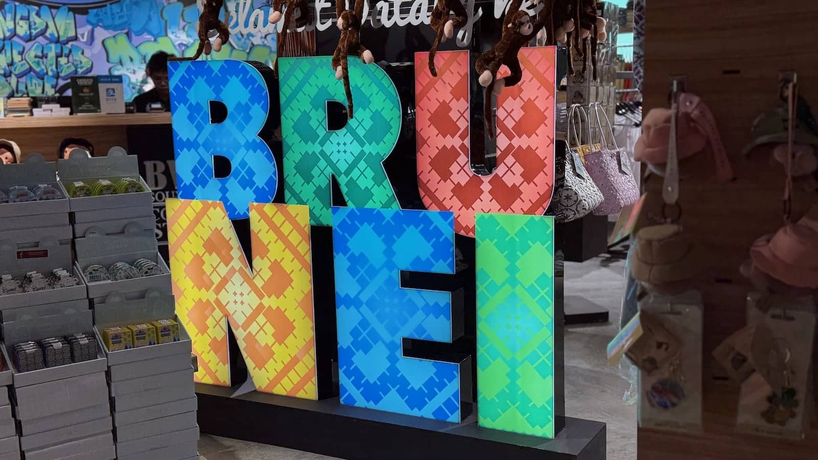 Brightly colored letters spelling out Brunei at a souvenir shop.