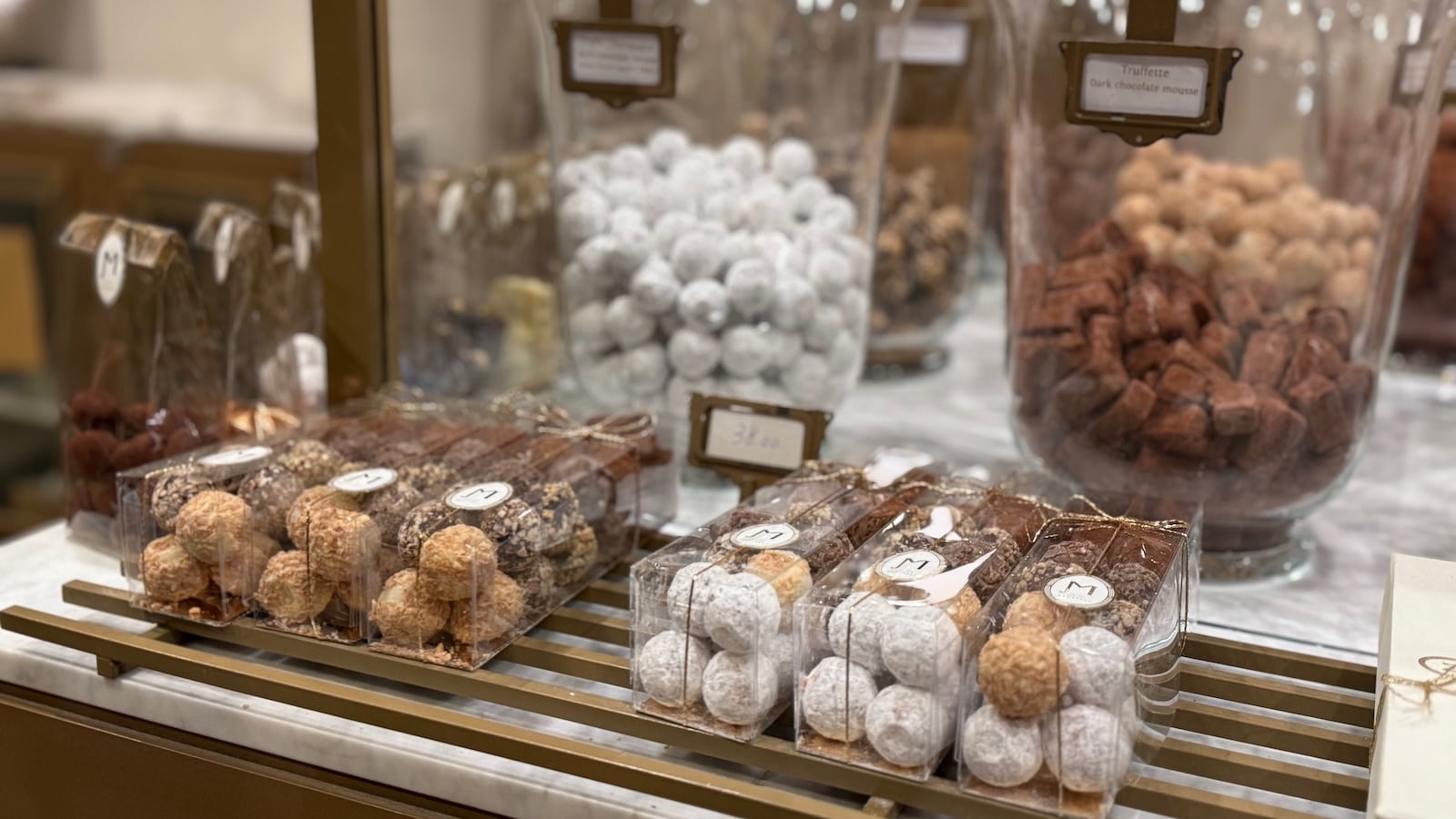 A close up of chocolate truffles for sale at a chocolate shop in Brussels.