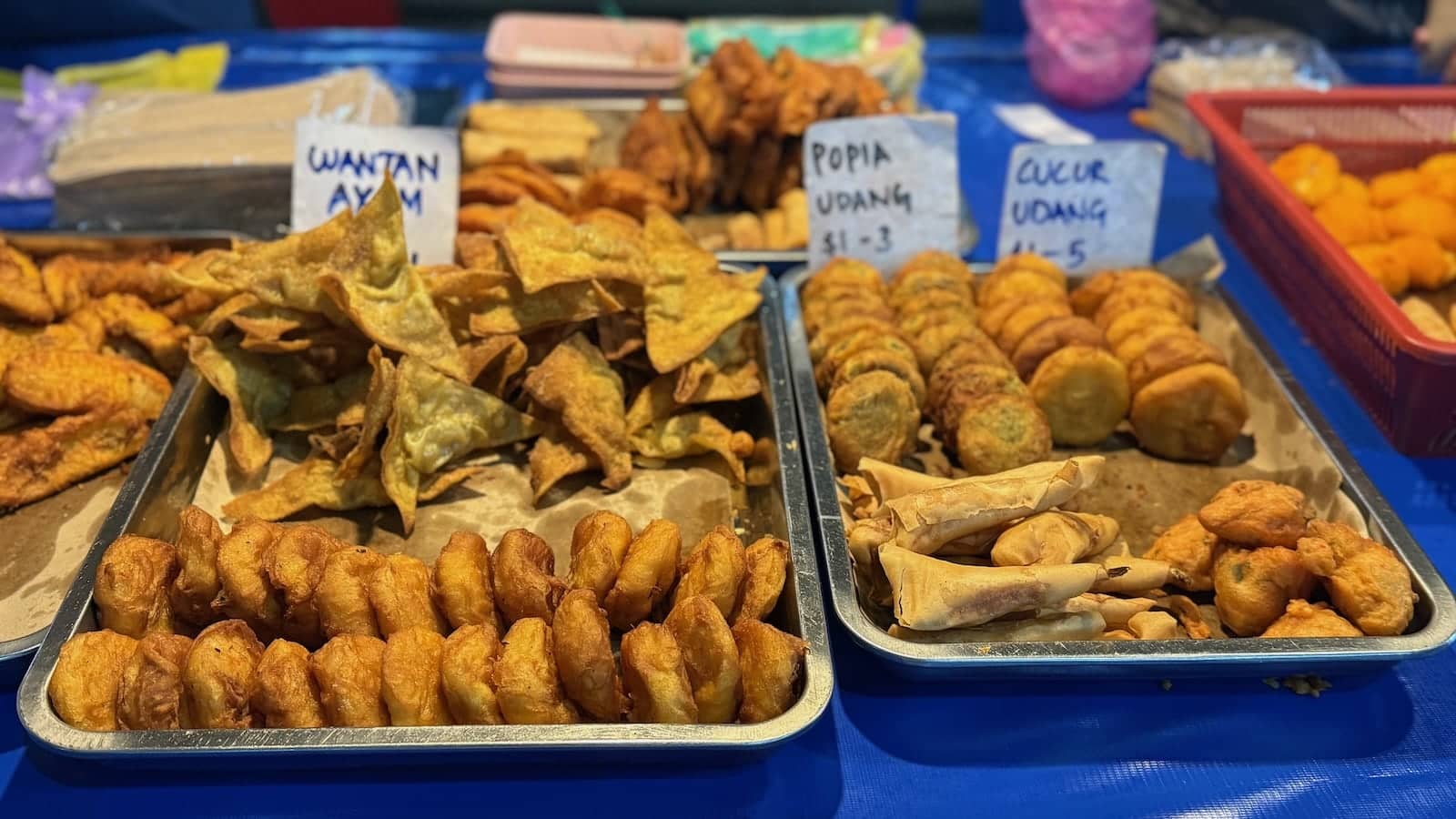 A close up of snacks for sale at a night market in Brunei.