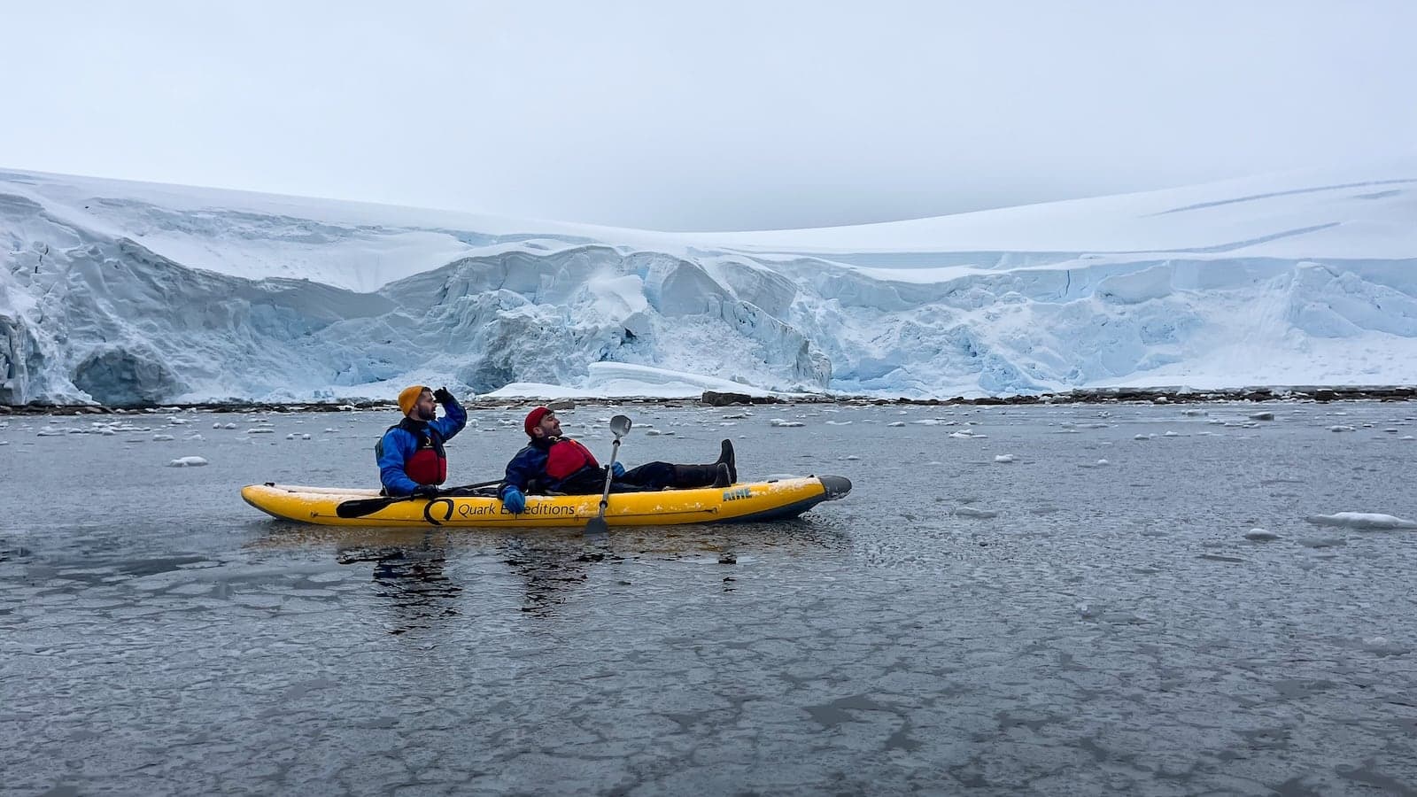 Gay couple kayaking in Antarctica.