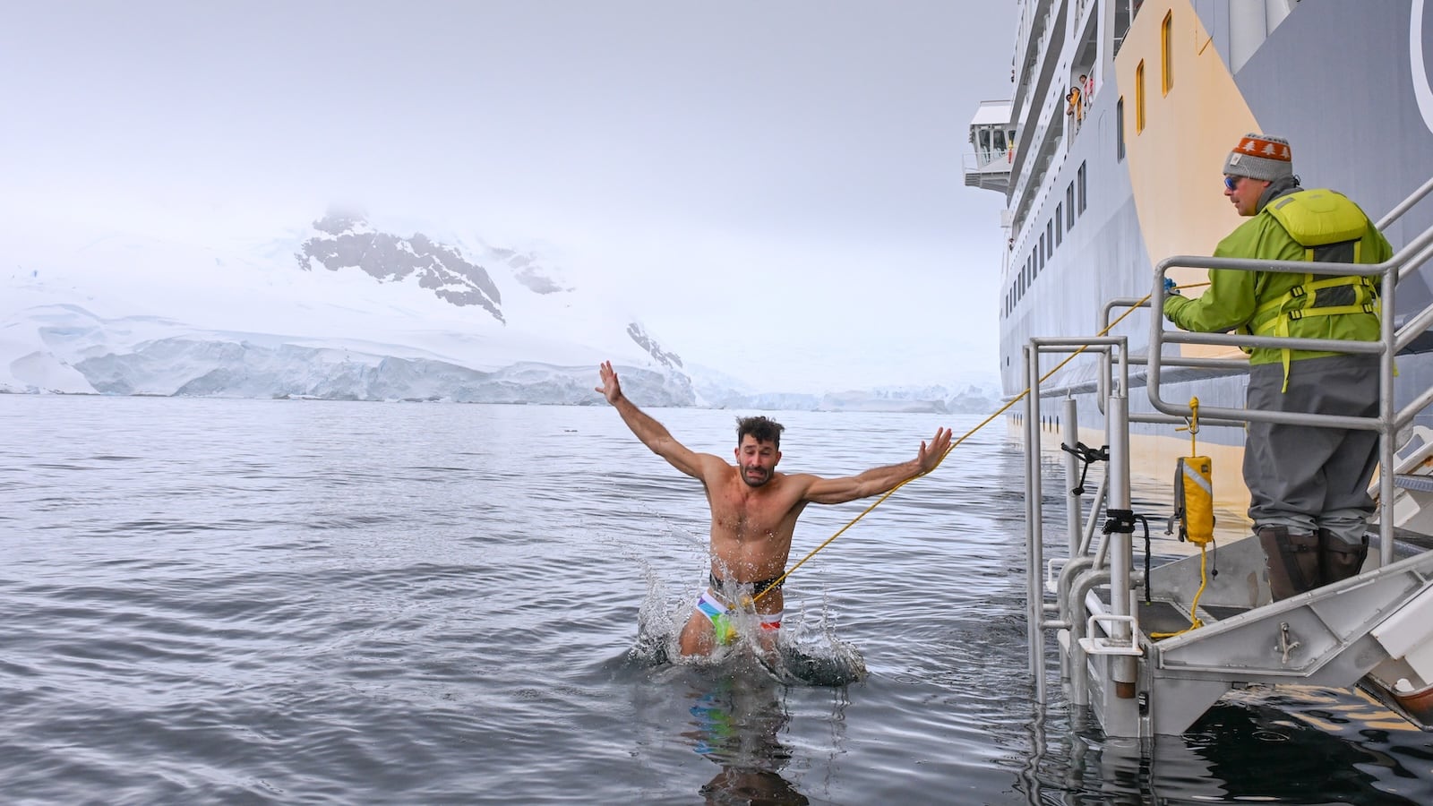 Stefan doing the polar plunge in the Antarctica frozen waters.