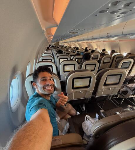 Stefan taking a selfie in a Royal Brunei Airlines plane.