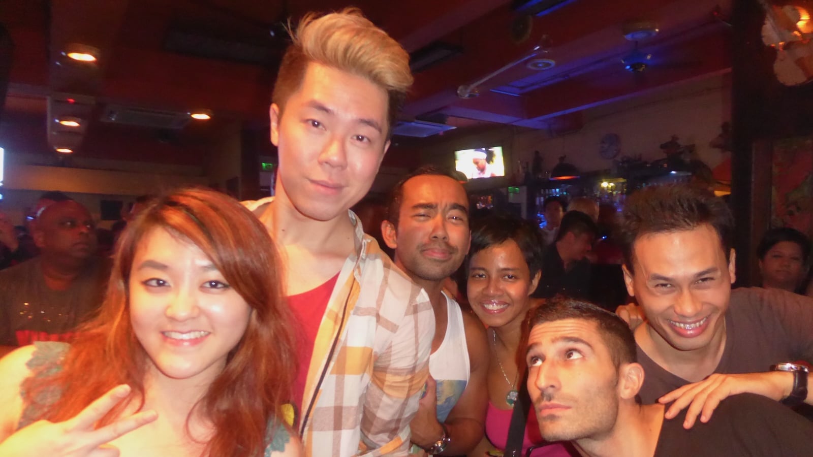 Stefan and some Malaysian friends posing in a Kuala Lumpur bar at night.