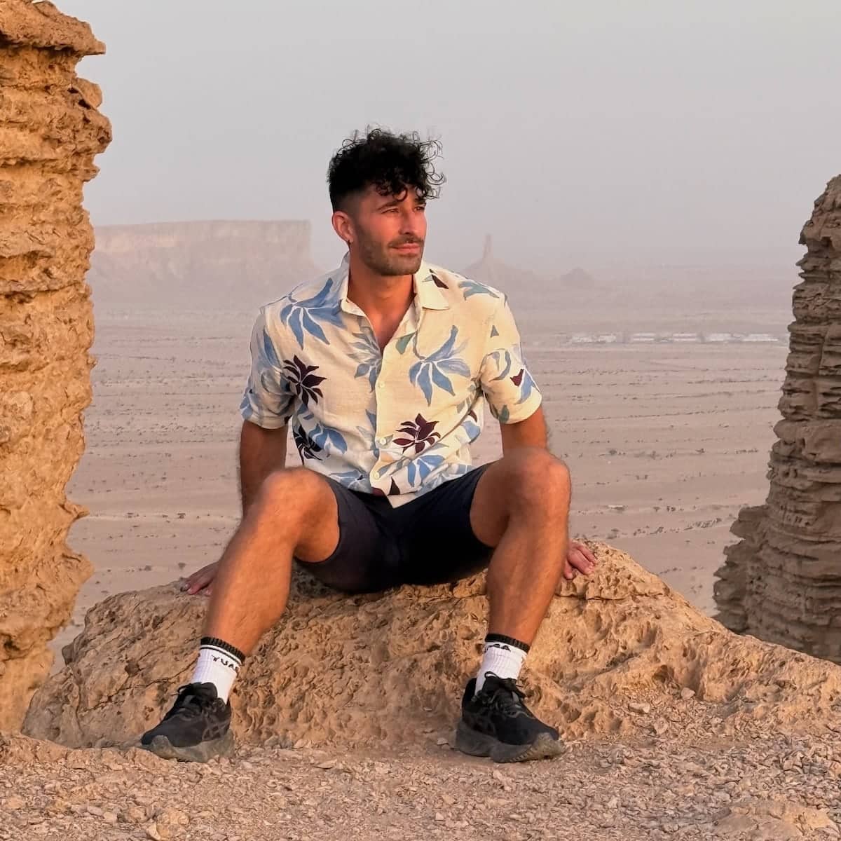 Stefan sitting on a rock at the Edge of World near Riyadh in Saudi Arabia.