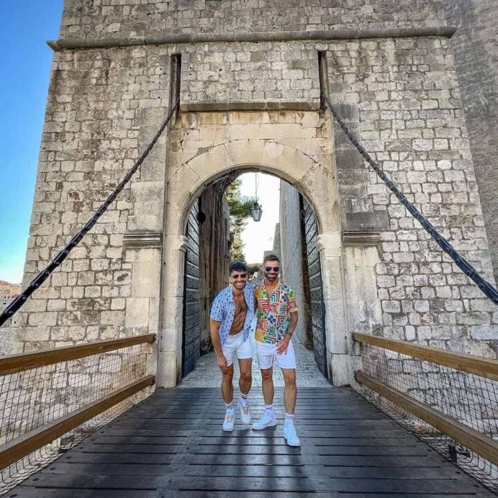 Gay couple at the main gate of the Dubrovnik old town.