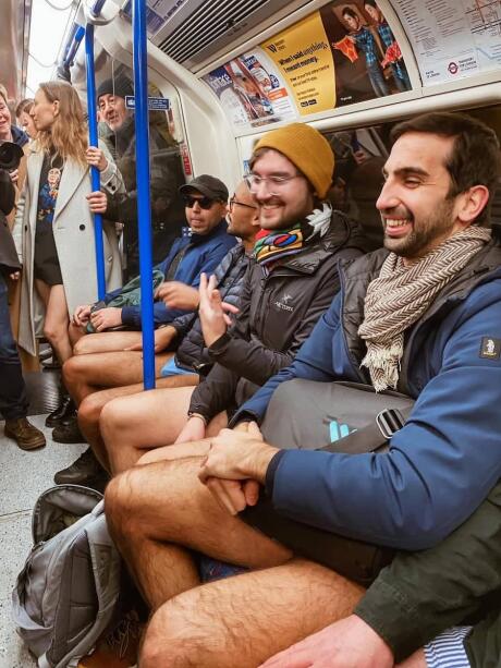 Group of men in the London Underground tube part of the No Trousers Tube Ride.