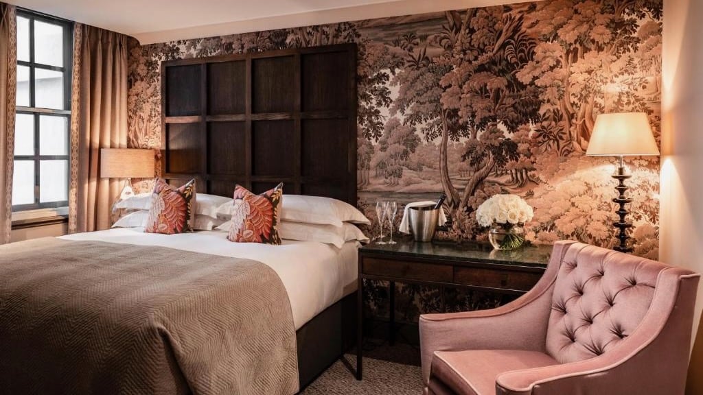 The luxurious lush bedroom at the Bloomsbury Hotel in London.