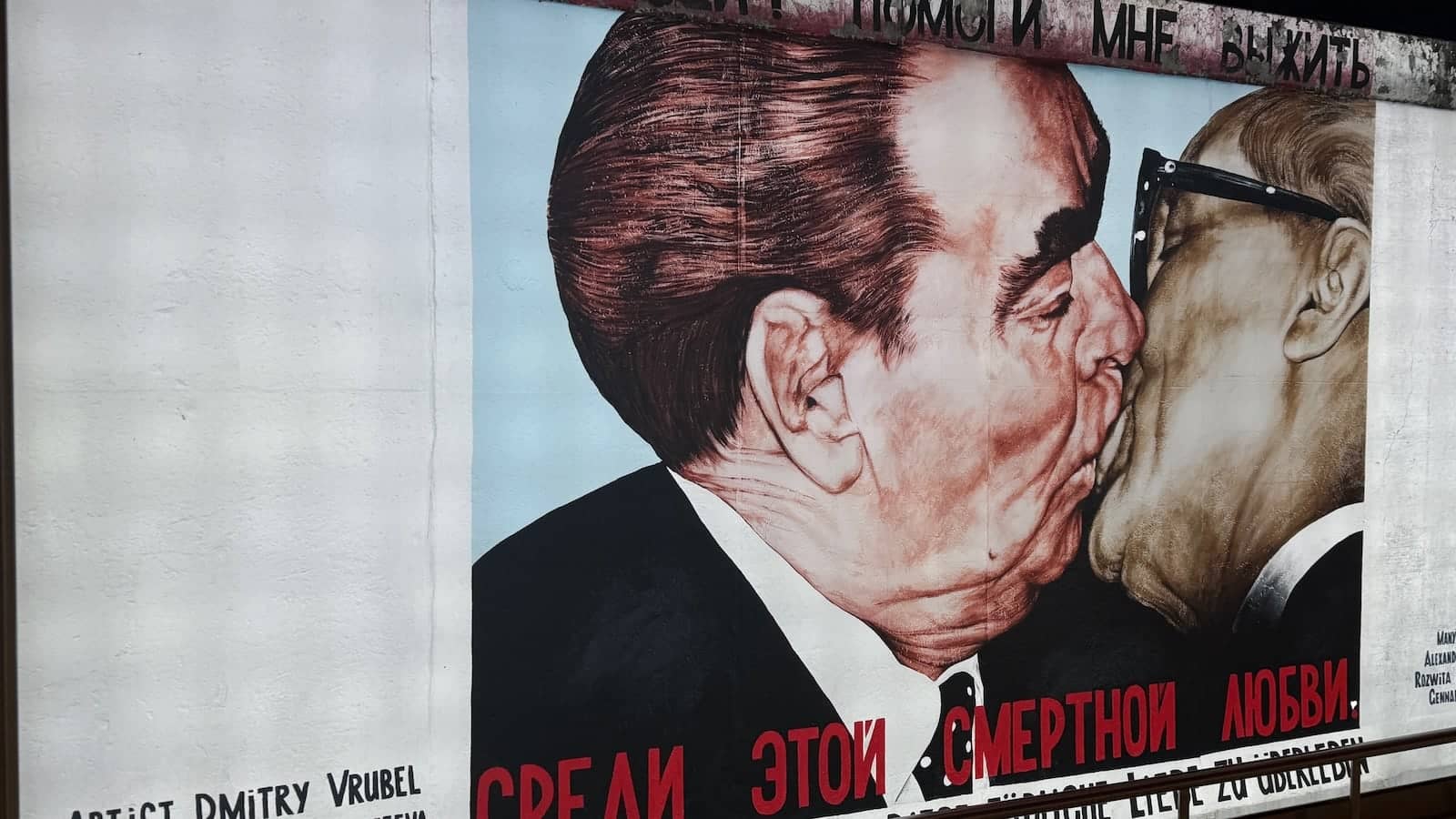 The famous Communist Kiss art mural at the East Side Gallery in Berlin.