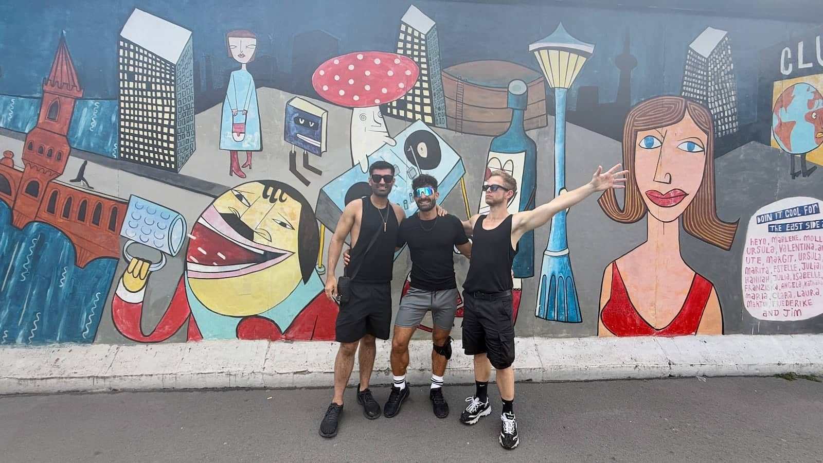 Group of gay friends at the East Side Gallery in Berlin.