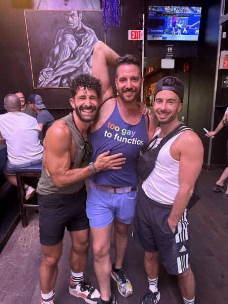 Gay guys in Vancouver gay bar in Davie Street village.