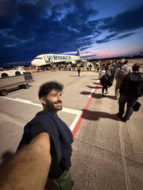 Stefan boarding the plane at Berlin Airport tarmac.