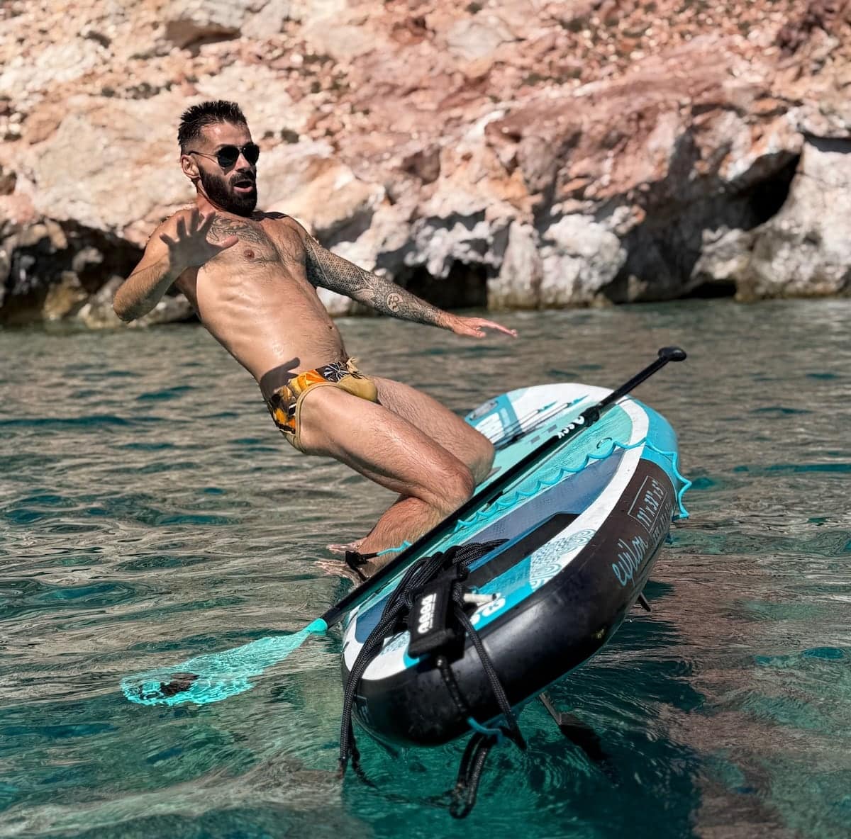 Seby falling off paddle board on Greece gay cruise.