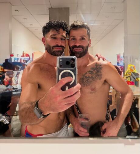 Gay couple toilet selfie at La Demence gay party in Brussels.